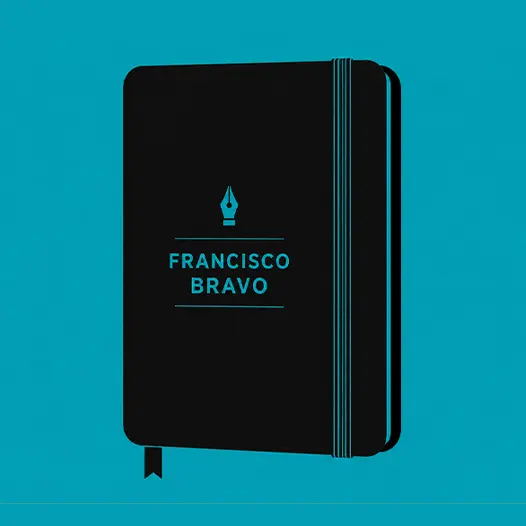 A moleskine with the name Francisco Bravo on top of it